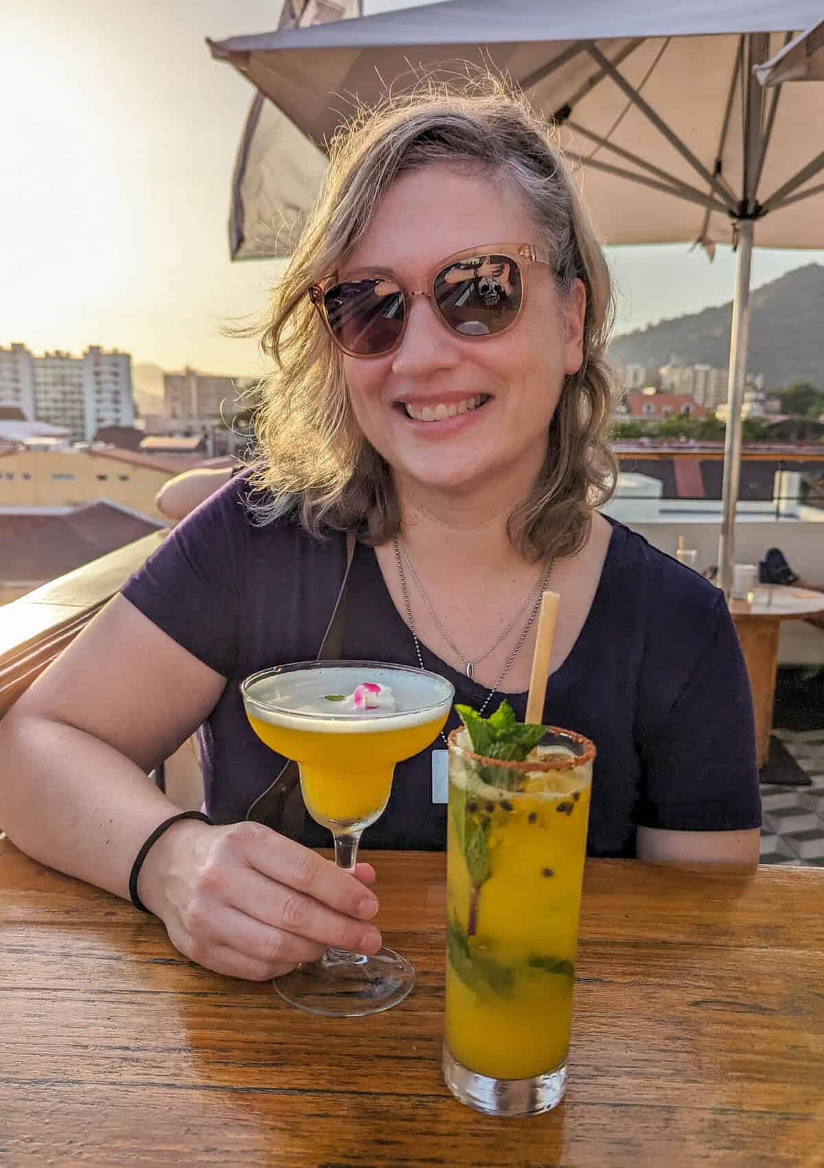 Dalene enjoying a cocktail on a rooftop patio in Panama City
